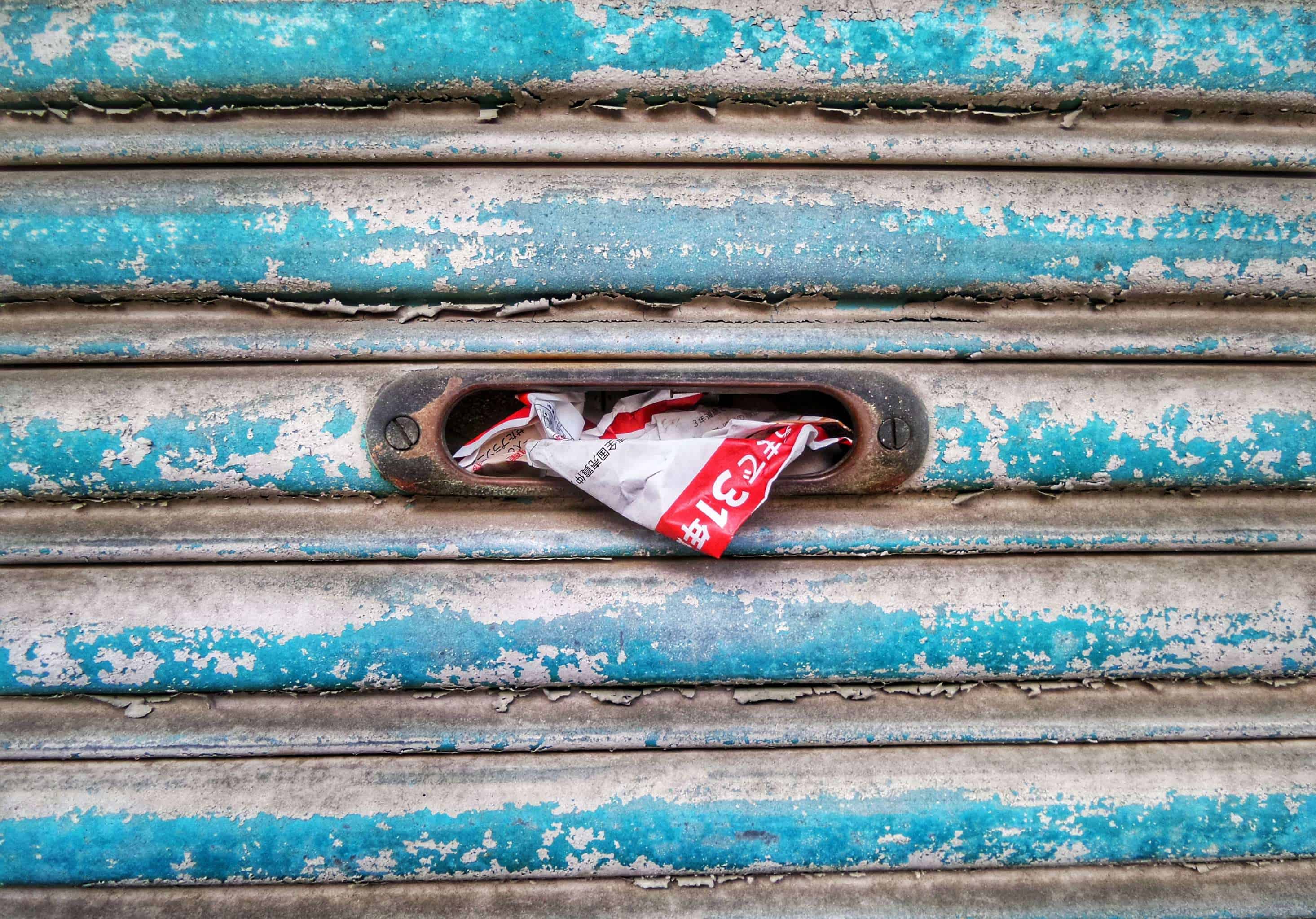 Crumpled advertising mail in a mailbox